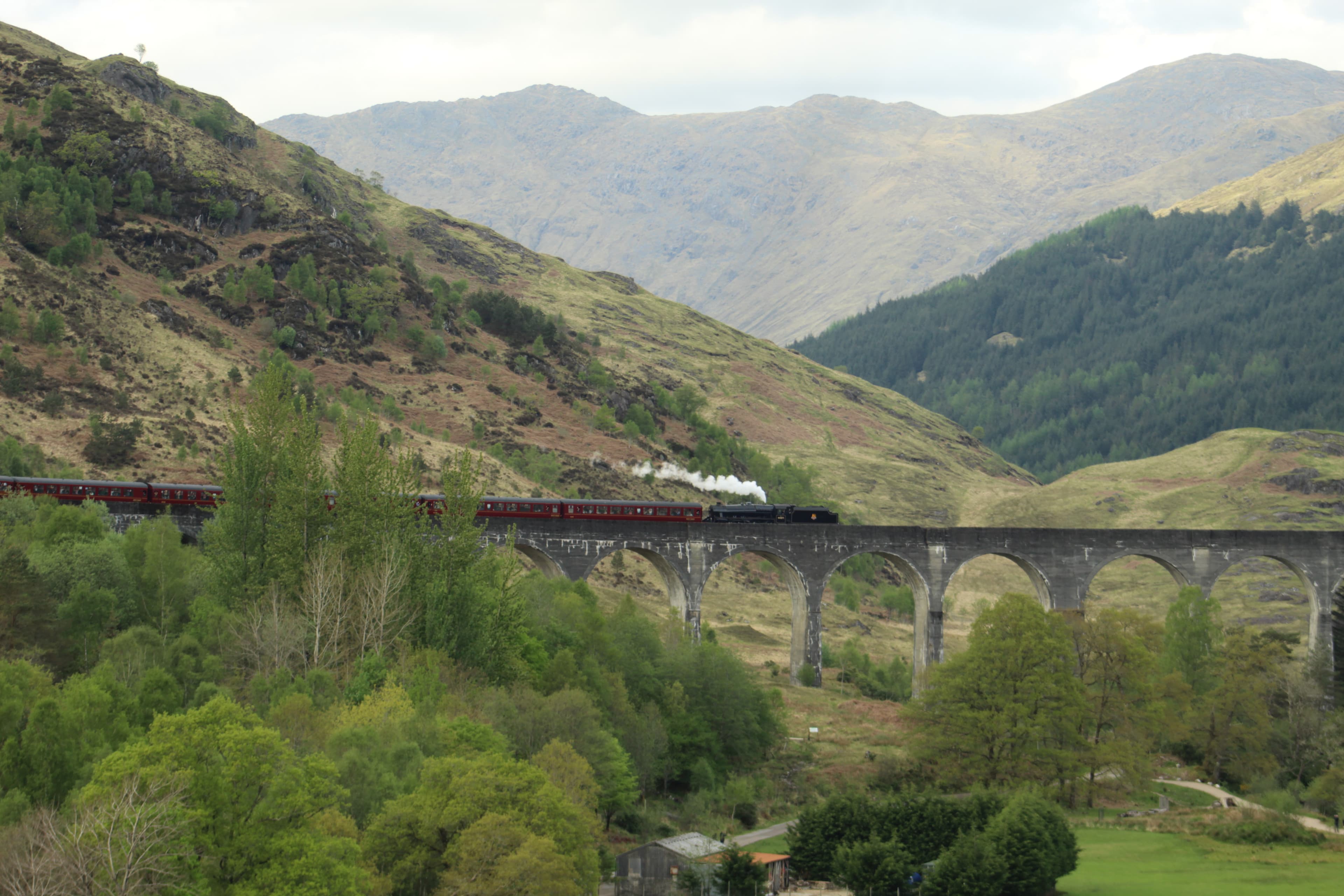 Jacobite steam train crossing Glenfinnan viaduct