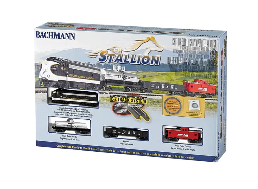 Retail box of the Bachmann The Stallion N scale train set, showing the locomotive, tank car, gondola and caboose in a mountain landscape, with small pictures of each piece, a 24-inch circle of track and a speed controller.
