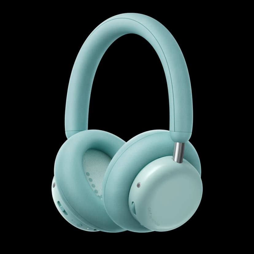 Light green over-ear headphones with matching padded headband and ear cushions, shown from a three-quarter angle