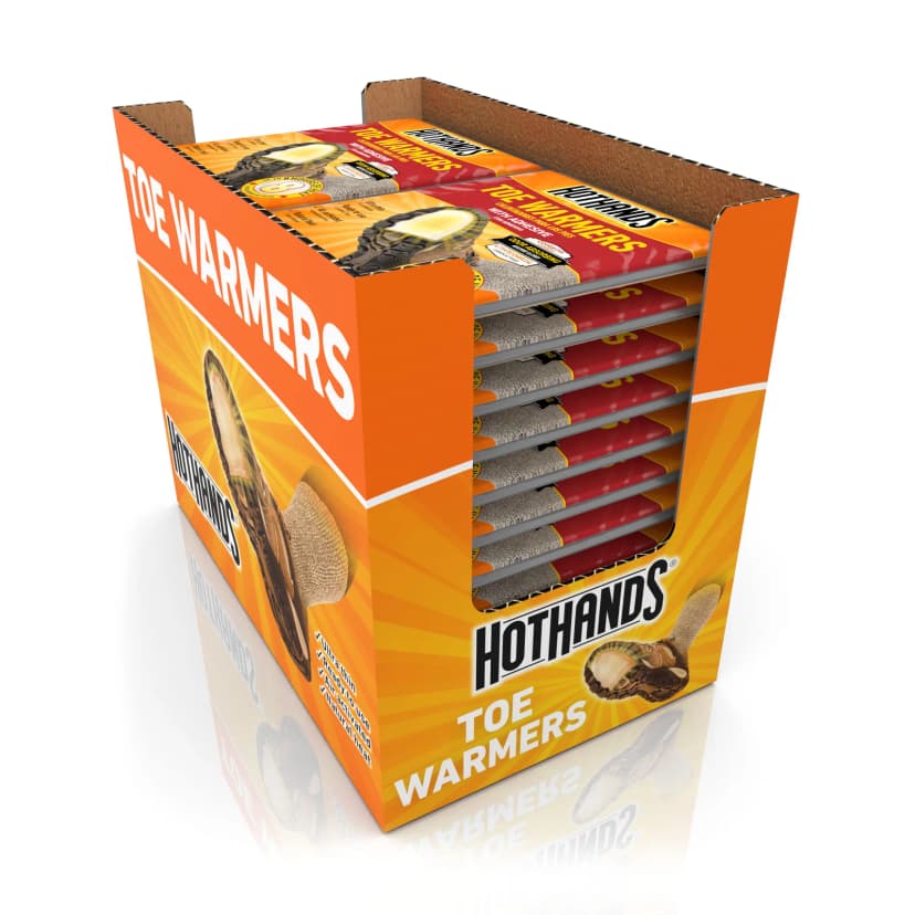 Orange HotHands Toe Warmers display carton holding stacked toe warmer packs