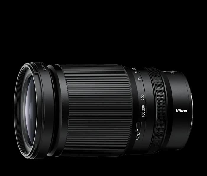 Side view of a telephoto zoom lens with a ribbed zoom ring, a focal length scale and a small lock switch